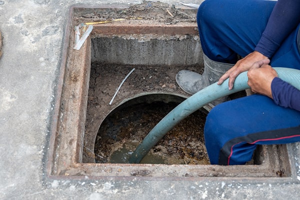 foul odors, slow drainage, and visible grease buildup are signs that grease trap pumping is needed